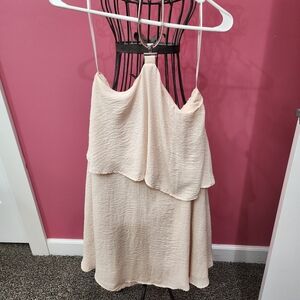 Sleeveless, backless,  summer dress with decorative neck strap.